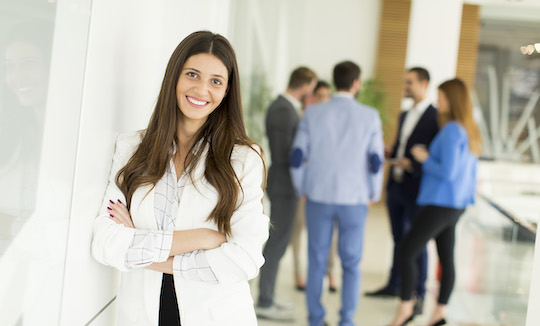 Businesswoman standing with her arms crossed