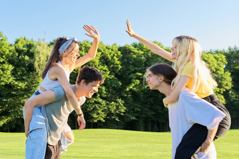 Happy group of teenagers having fun outdoors
