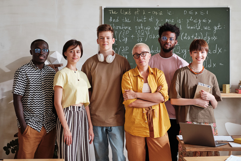 Teacher with students standing in the classroom