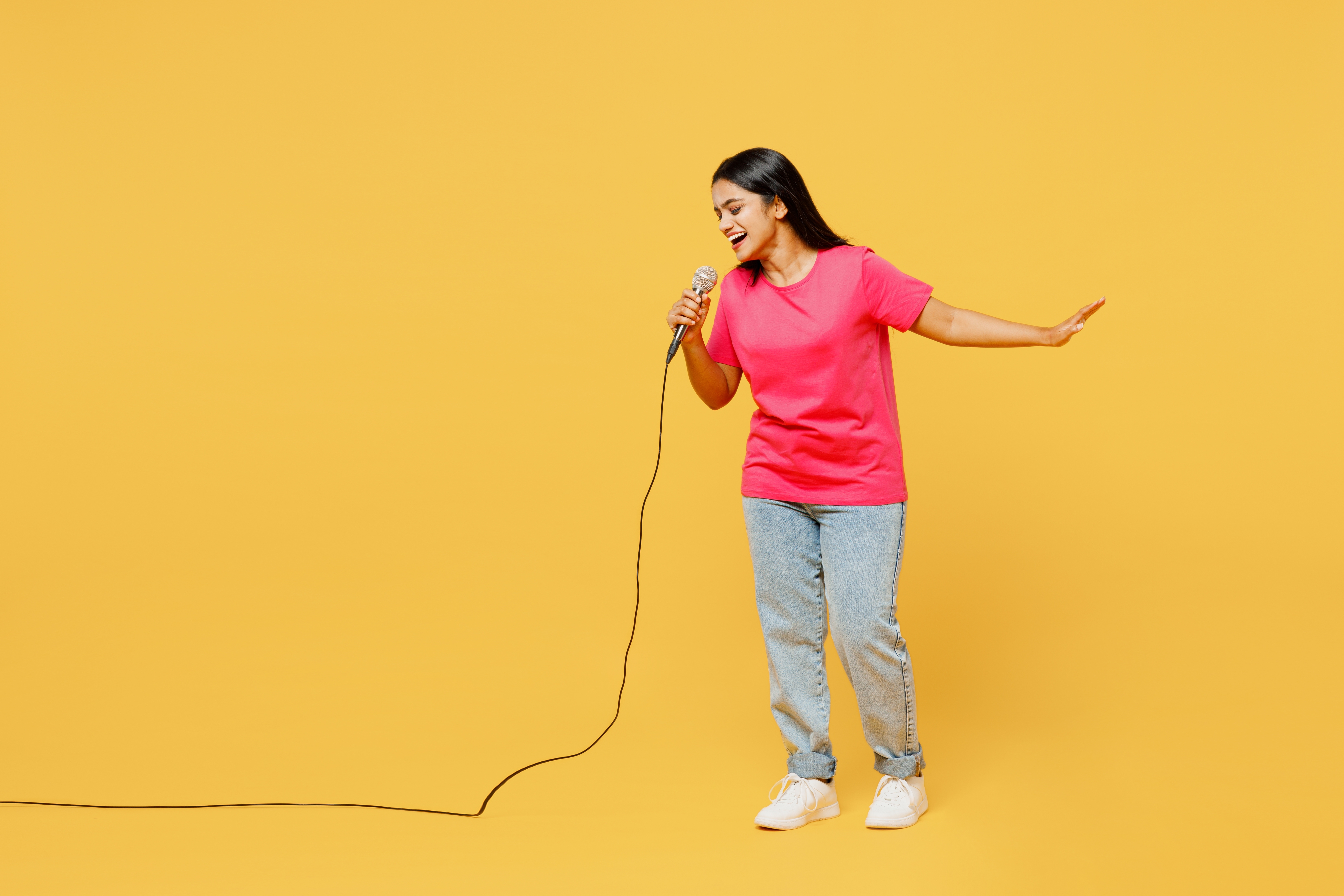 Full,Body,Singer,Young,Happy,Indian,Woman,Wearing,Pink,T-shirt