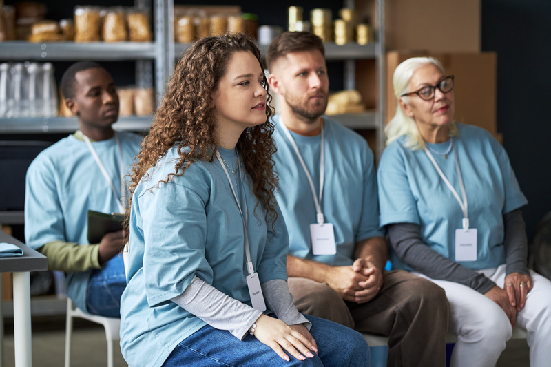Group Gathering of Diverse Volunteers in Community Center