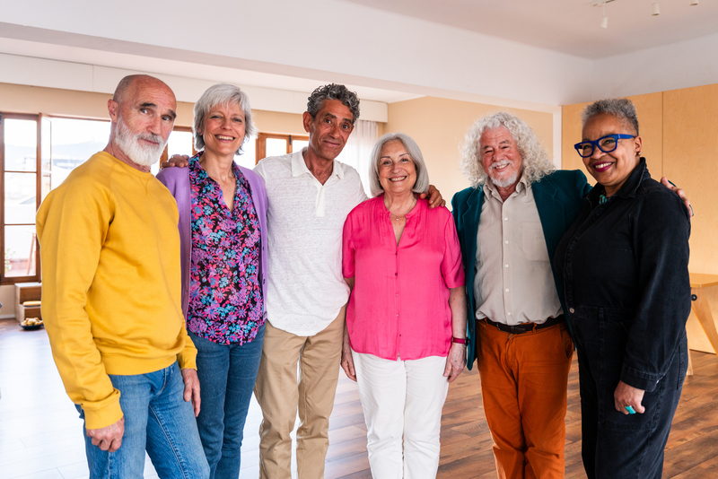 Group of senior friends bonding at home for dinner party