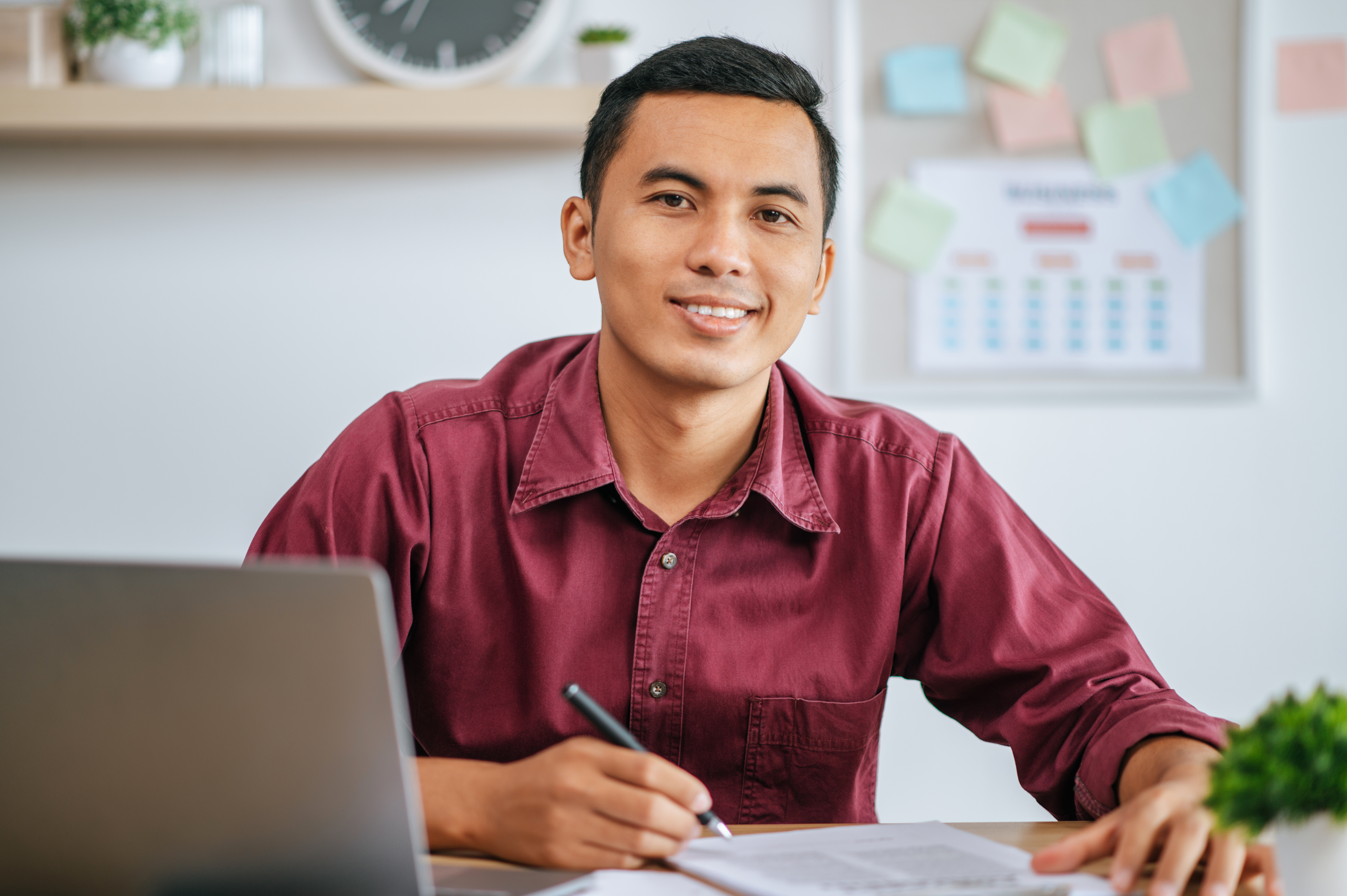 A man working in office with papers