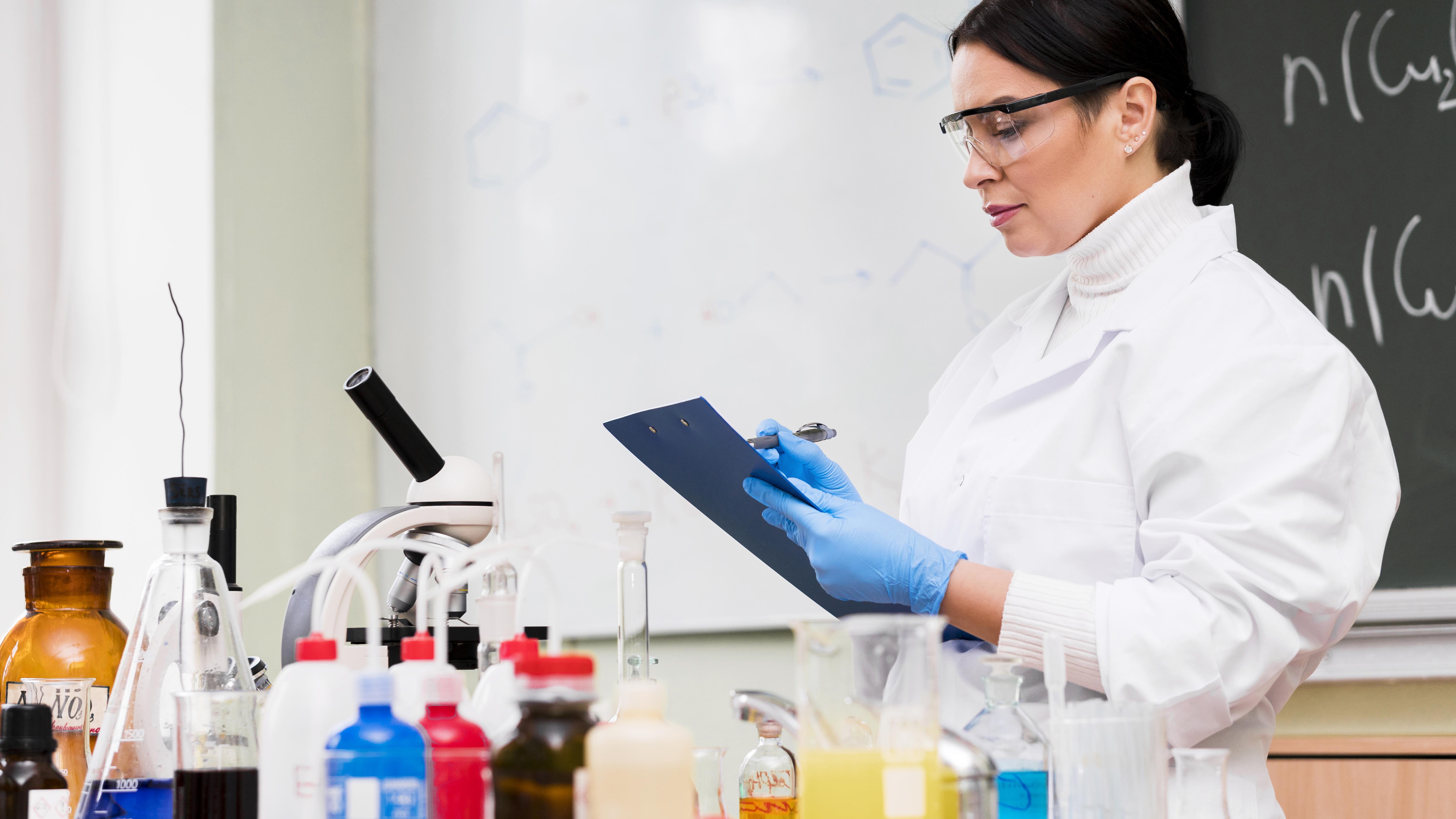 woman-taking-notes-laboratory